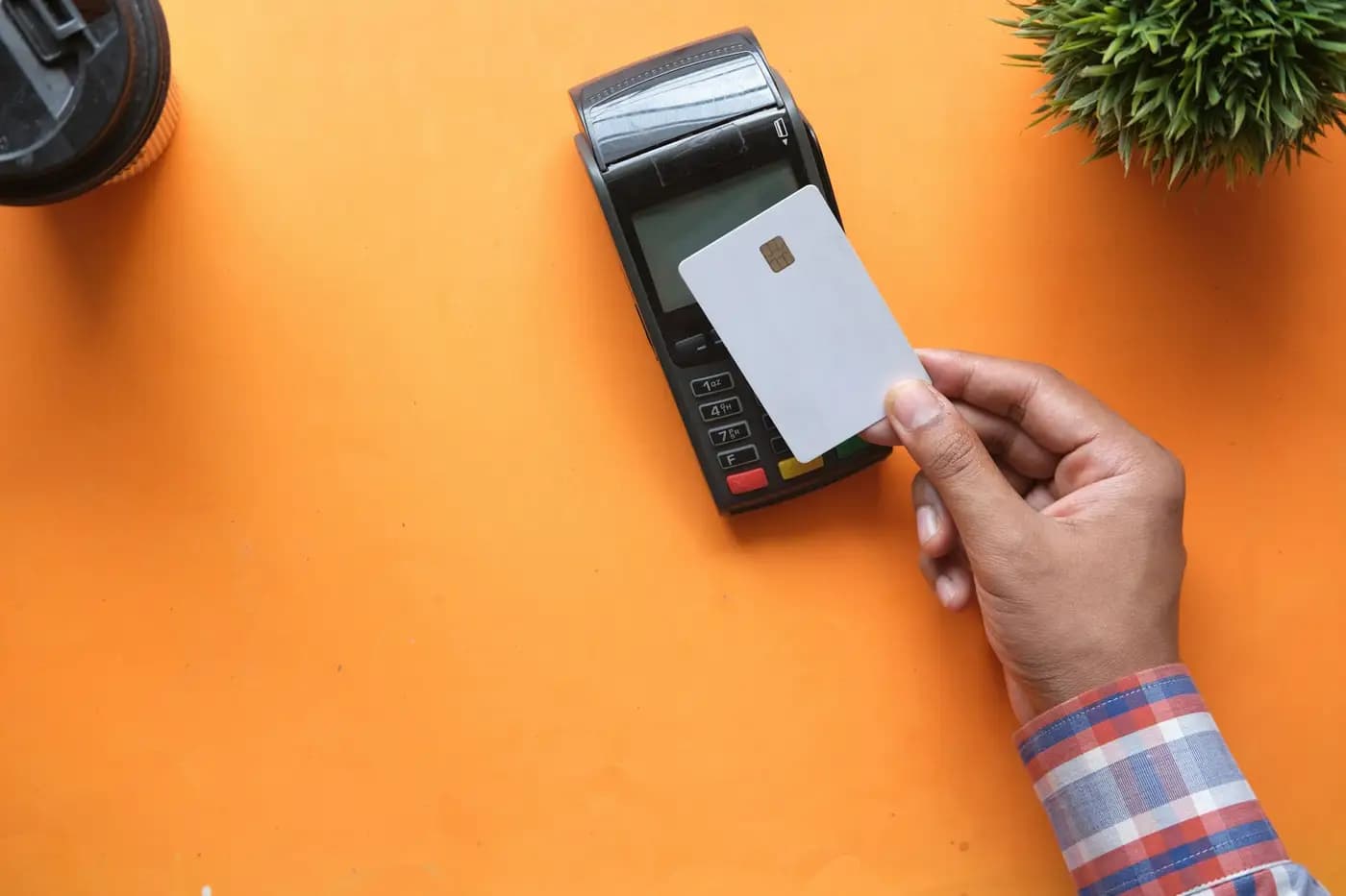 Customer making a card payment at a payment terminal