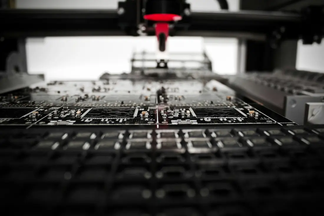 A pick-and-place machine working on a circuit board